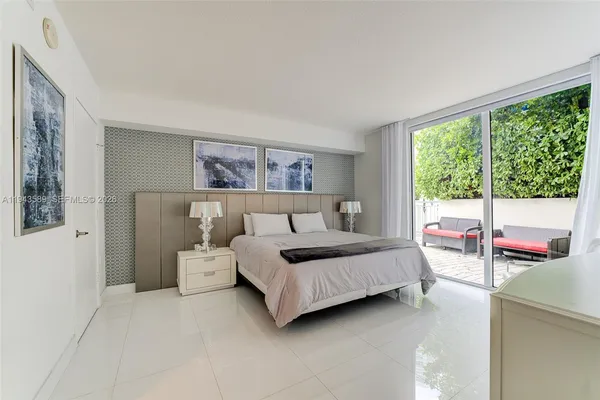 a bedroom with a bed and a view of bedroom