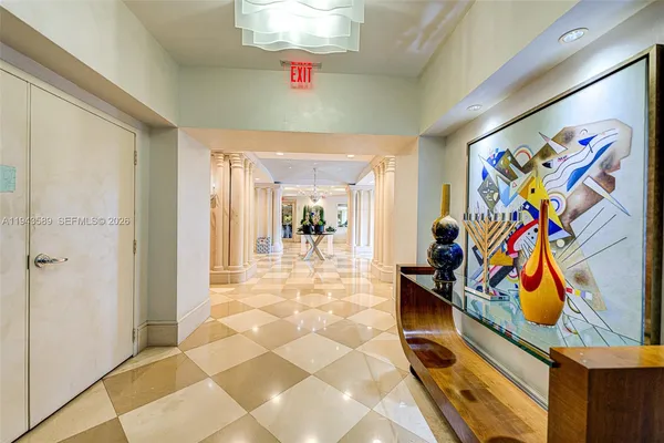 a view of a entryway with furniture and a chandelier