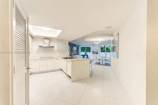 a kitchen with a sink and a refrigerator