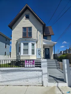 a front view of a house with yard
