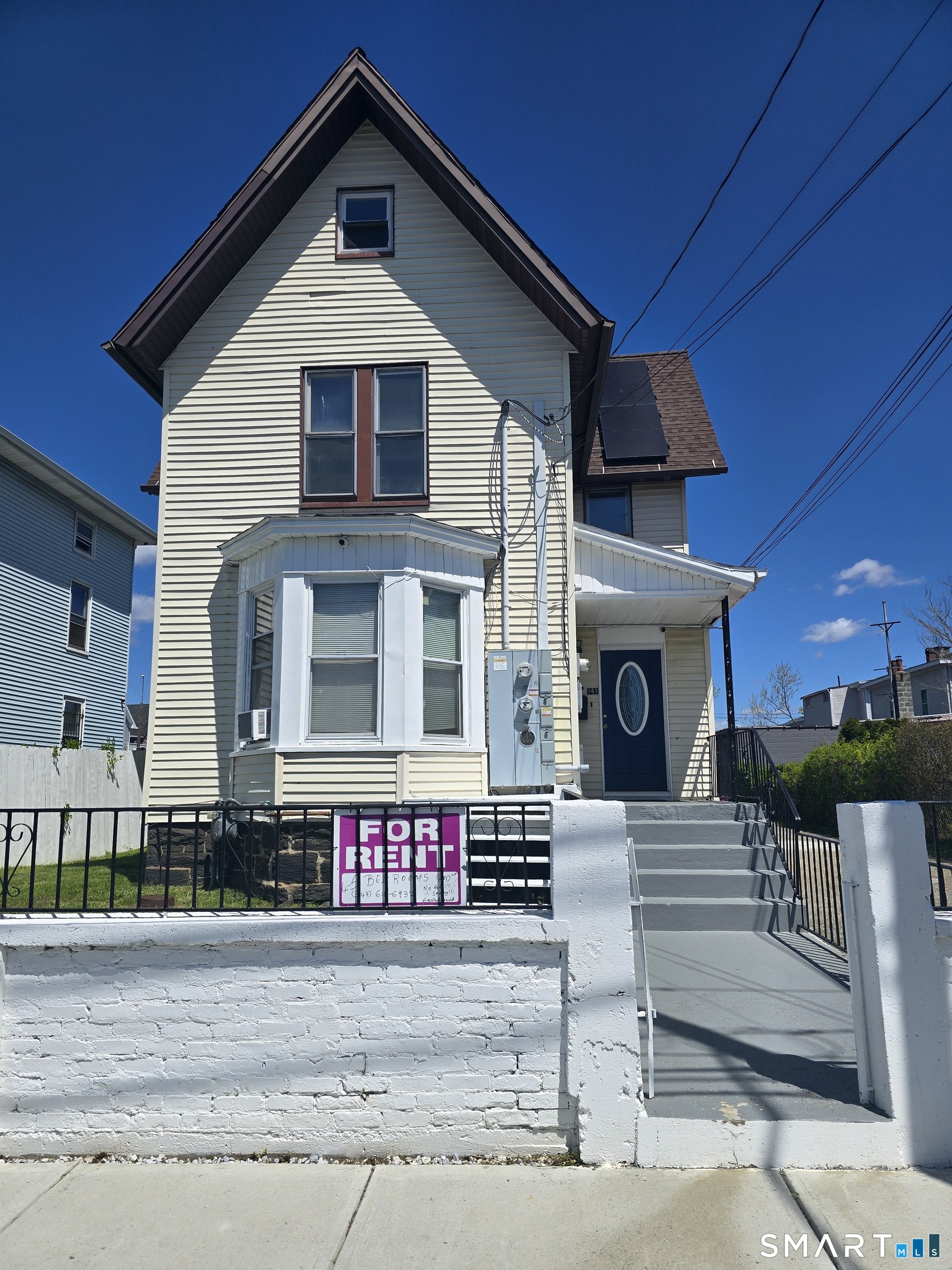 141 Hicks Street Bridgeport, CT 06608 - Photo 1 of 3 a front view of a house with yard
