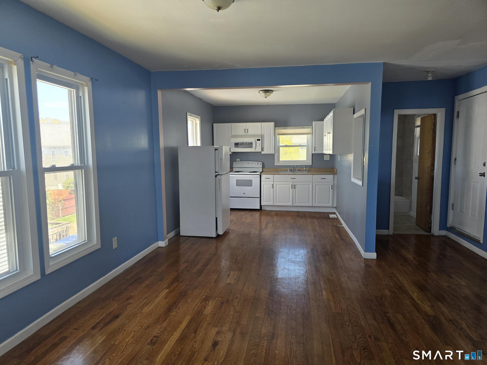 141 Hicks Street Bridgeport, CT 06608 - Photo 3 of 3 a view of a kitchen cabinets and wooden floor