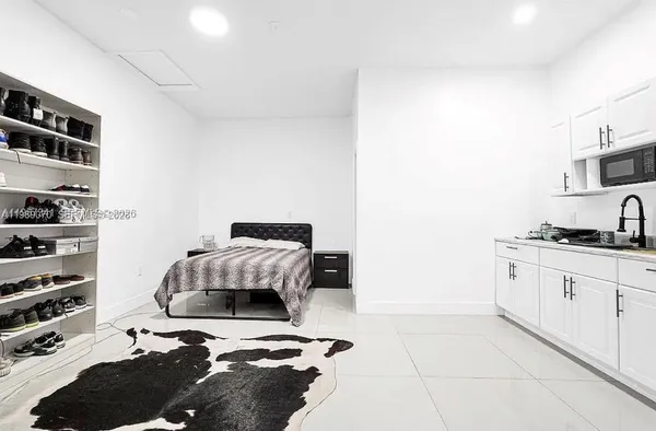 a bedroom with a bed and a cabinets