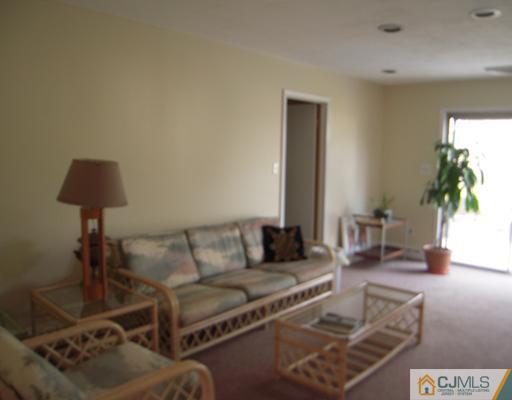 13 Sandra Road East Brunswick, NJ 08816 - Photo 8 of 15 a living room with furniture and a table