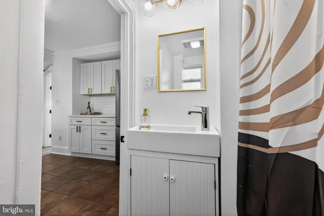 a kitchen with cabinets appliances and a sink