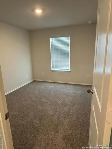 en empty room with windows