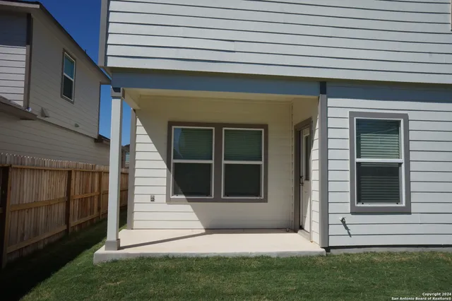 a view of small house with front door