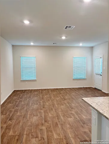 a view of an empty room and window