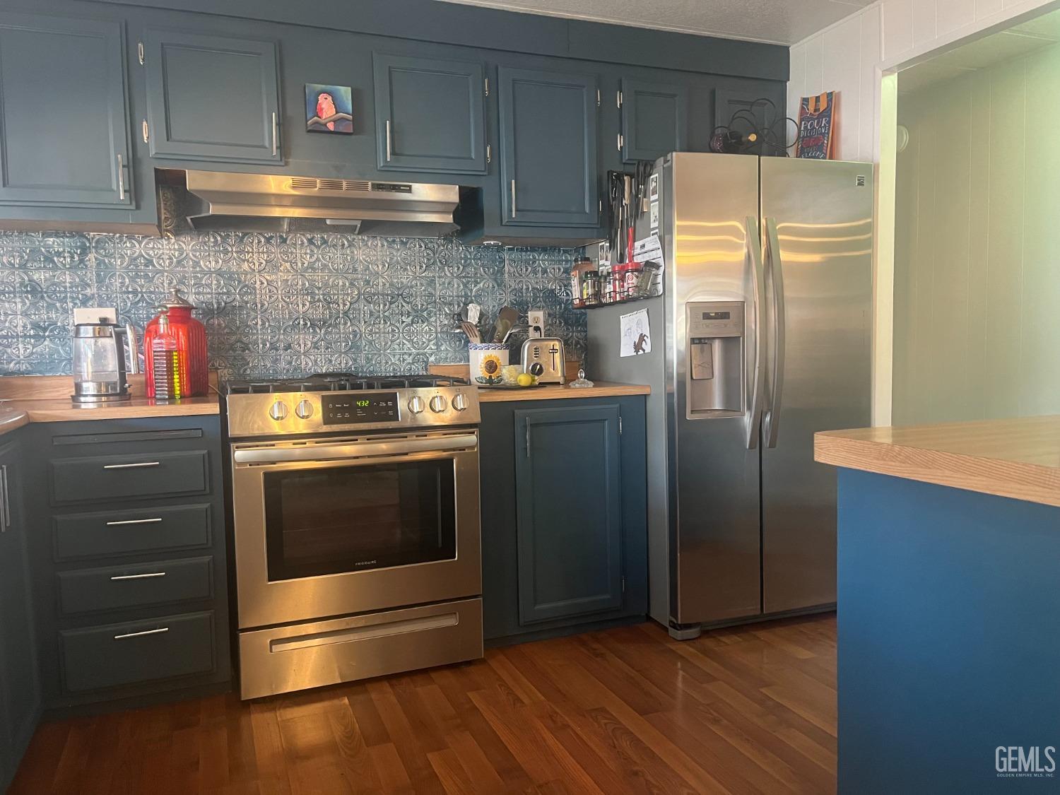 Undisclosed Address Santa Maria, CA 93454 - Photo 12 of 43 a kitchen with stainless steel appliances granite countertop a refrigerator and a stove