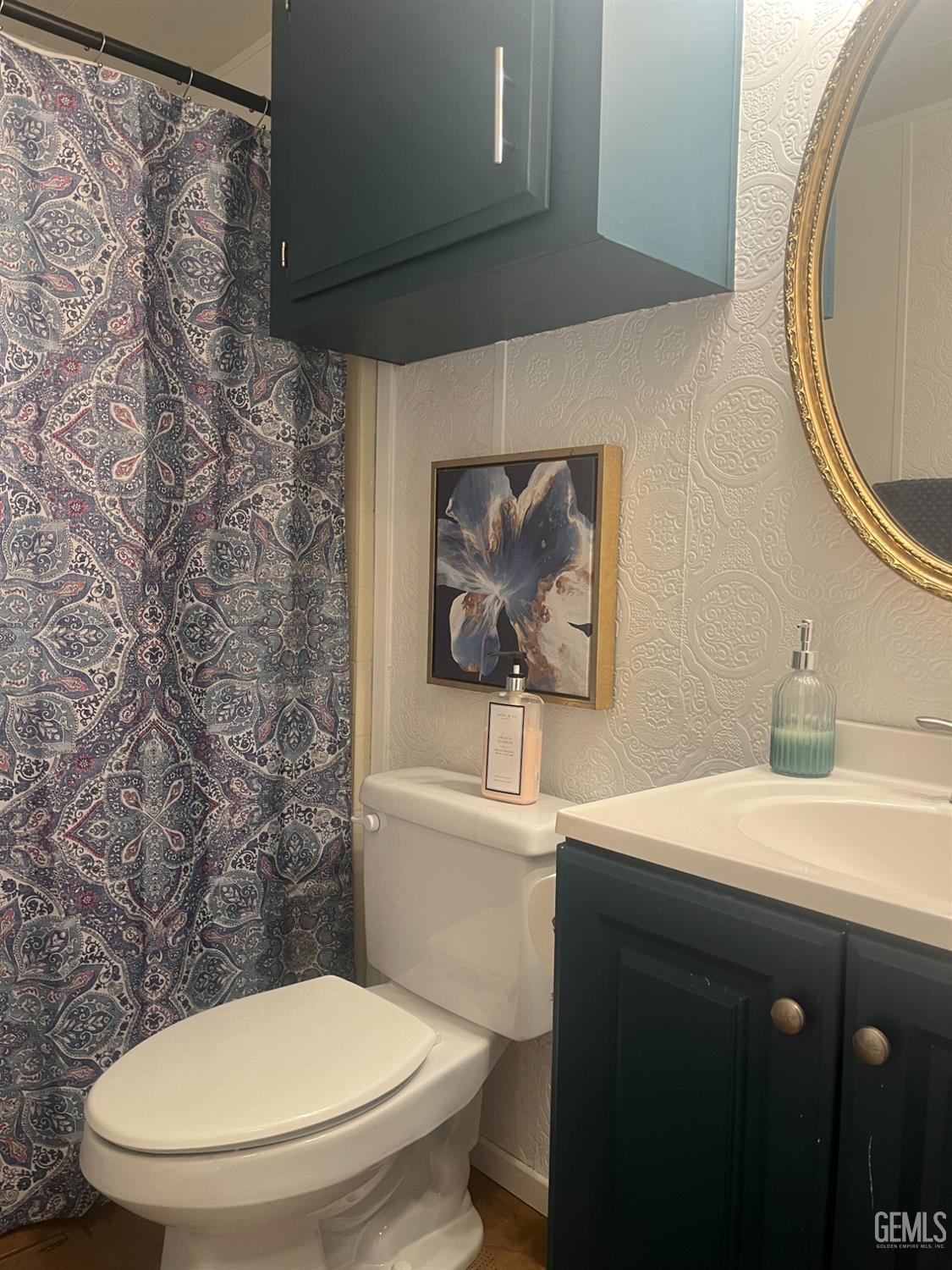 Undisclosed Address Santa Maria, CA 93454 - Photo 18 of 43 a bathroom with a toilet a sink and mirror