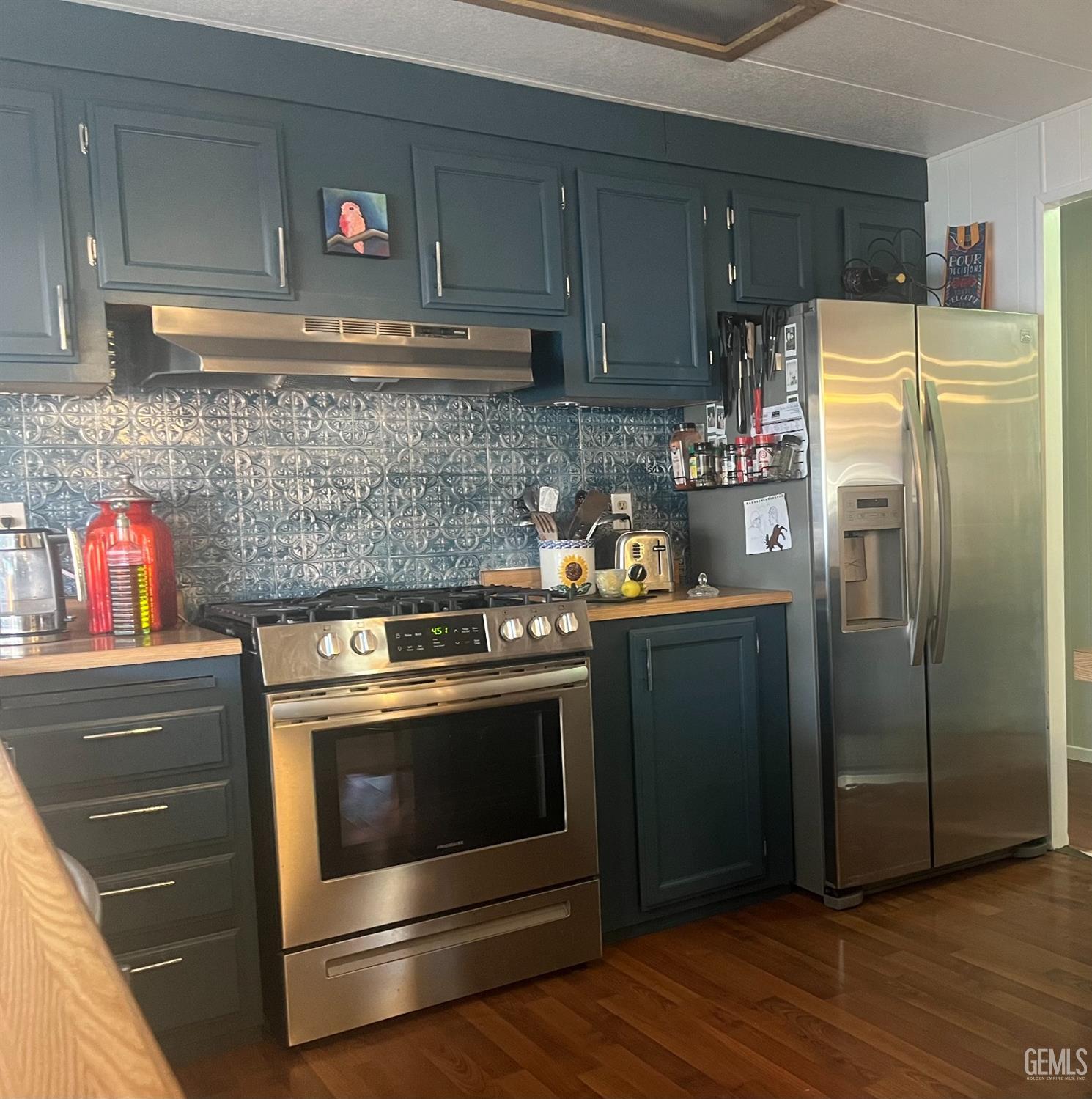 Undisclosed Address Santa Maria, CA 93454 - Photo 33 of 43 a kitchen with stainless steel appliances a stove and a refrigerator