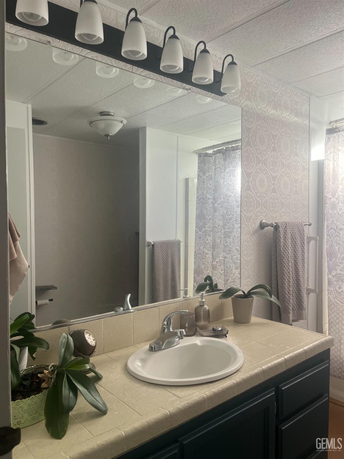 Undisclosed Address Santa Maria, CA 93454 - Photo 37 of 43 a bathroom with a sink double vanity and a mirror