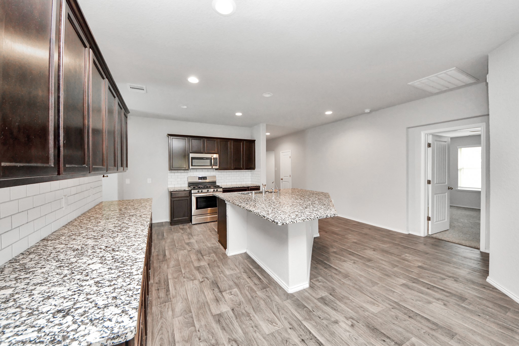 8302 Rose Petals Lane Rosharon, TX 77583 - Photo 5 of 42 Kitchen overlooking living area