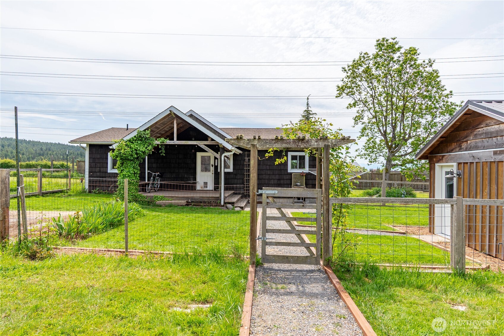123 School Road Lopez Island, WA 98261 - Photo 3 of 40 a view of a house with a swimming pool