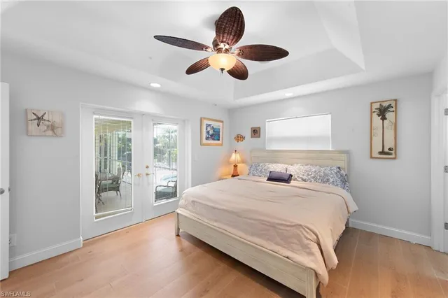 a bedroom with a large bed and a large window