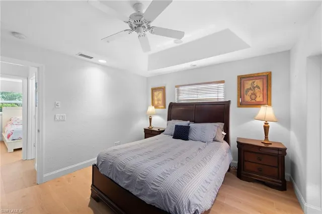 a bedroom with a bed and a lamp