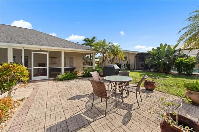 a outdoor space with a table and chairs