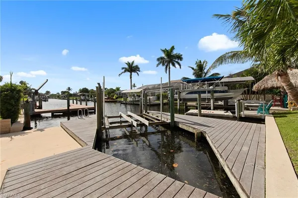 a view of a swimming pool with furniture