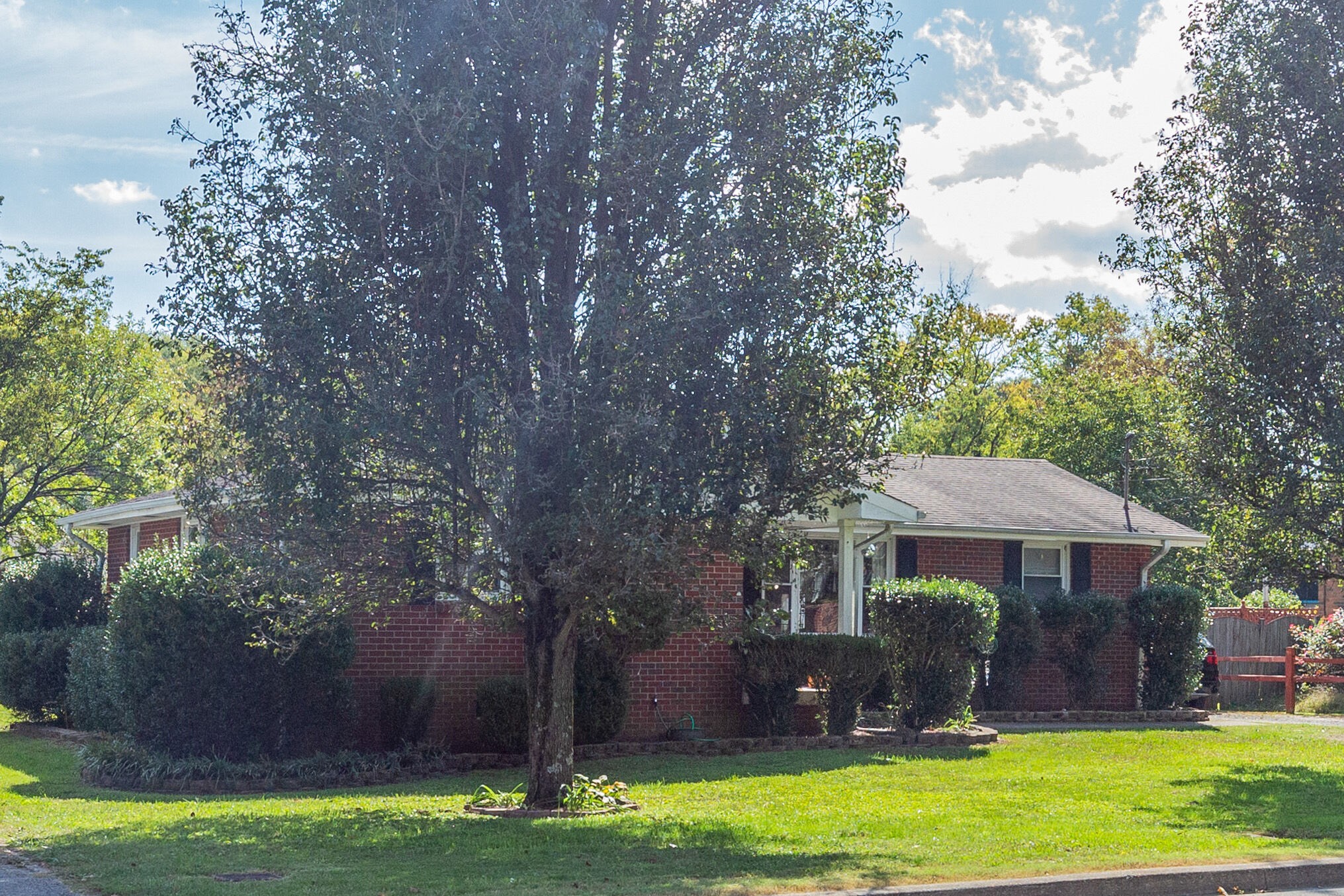 480 Rural Hill Road Nashville, TN 37217 - Photo 5 of 25 a front view of a house with a garden and trees