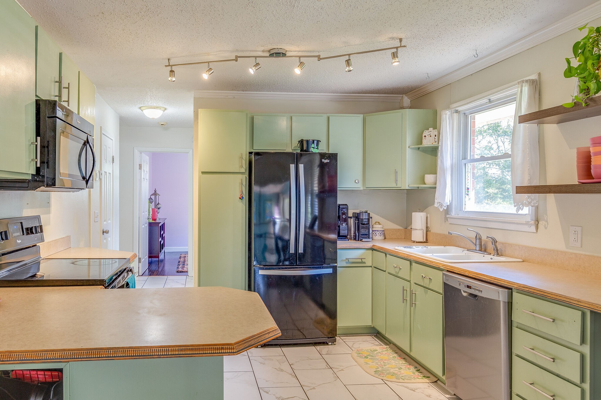 480 Rural Hill Road Nashville, TN 37217 - Photo 9 of 25 a kitchen with stainless steel appliances a sink stove and refrigerator