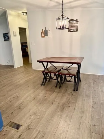 a kitchen with stainless steel appliances granite countertop a refrigerator and cabinets