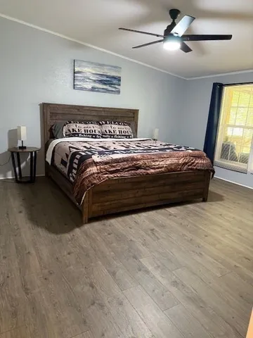 a bathroom with a sink a toilet a mirror and bathtub