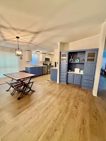 a room with wooden floor and furniture