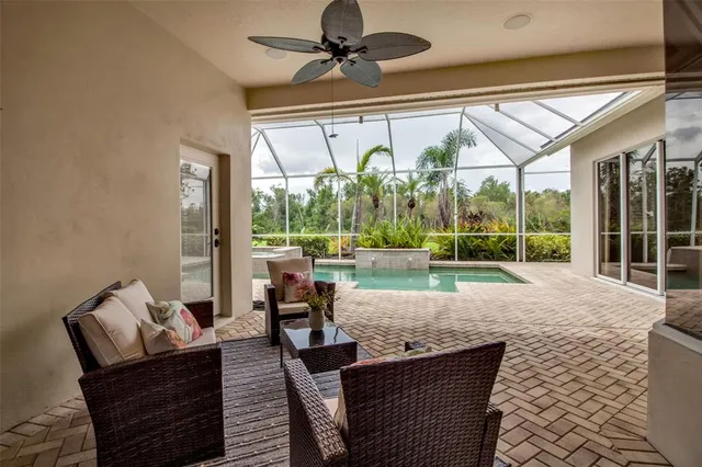 a living room with furniture and a yard