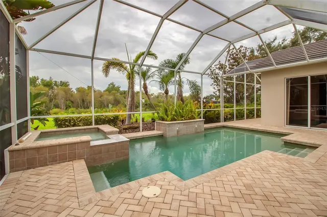 a view of swimming pool with a patio