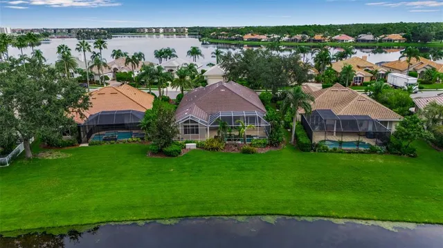 an aerial view of a house with garden space and a street view