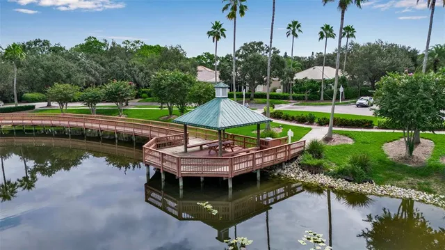 a view of a house with a yard and sitting area