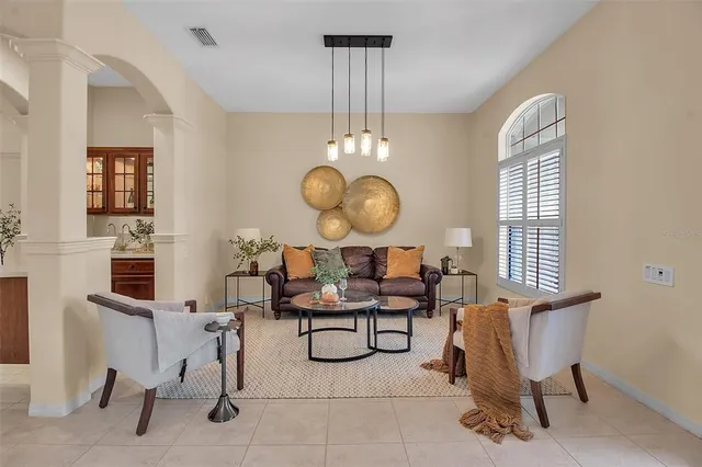 a view of a livingroom with furniture and a window