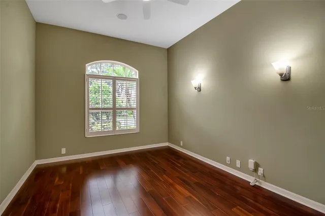a view of wooden floor and windows in a room