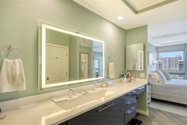 a living room with furniture a rug and a chandelier
