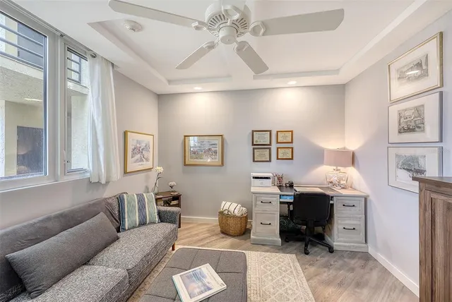 a view of a hallway with seating space