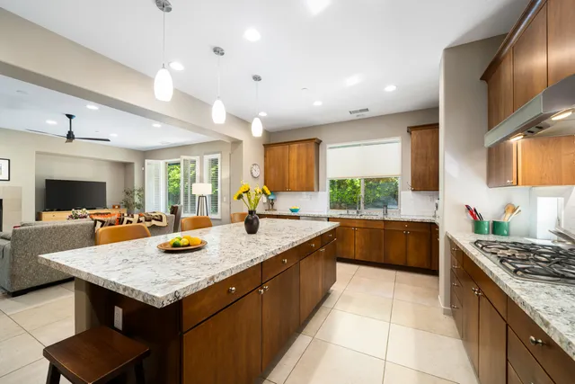 a kitchen with a stove and a white kitchen
