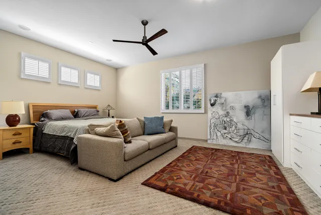 a living room with furniture and windows