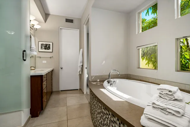 a bathroom with a bathtub and a sink