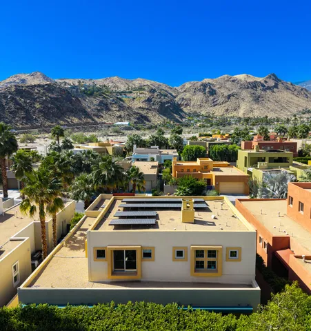 a view of a house with a yard from a balcony