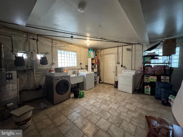 a kitchen with refrigerator and washer