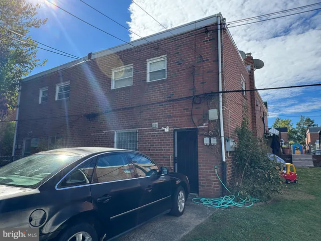 a view of backyard with wheel chair and potted plants