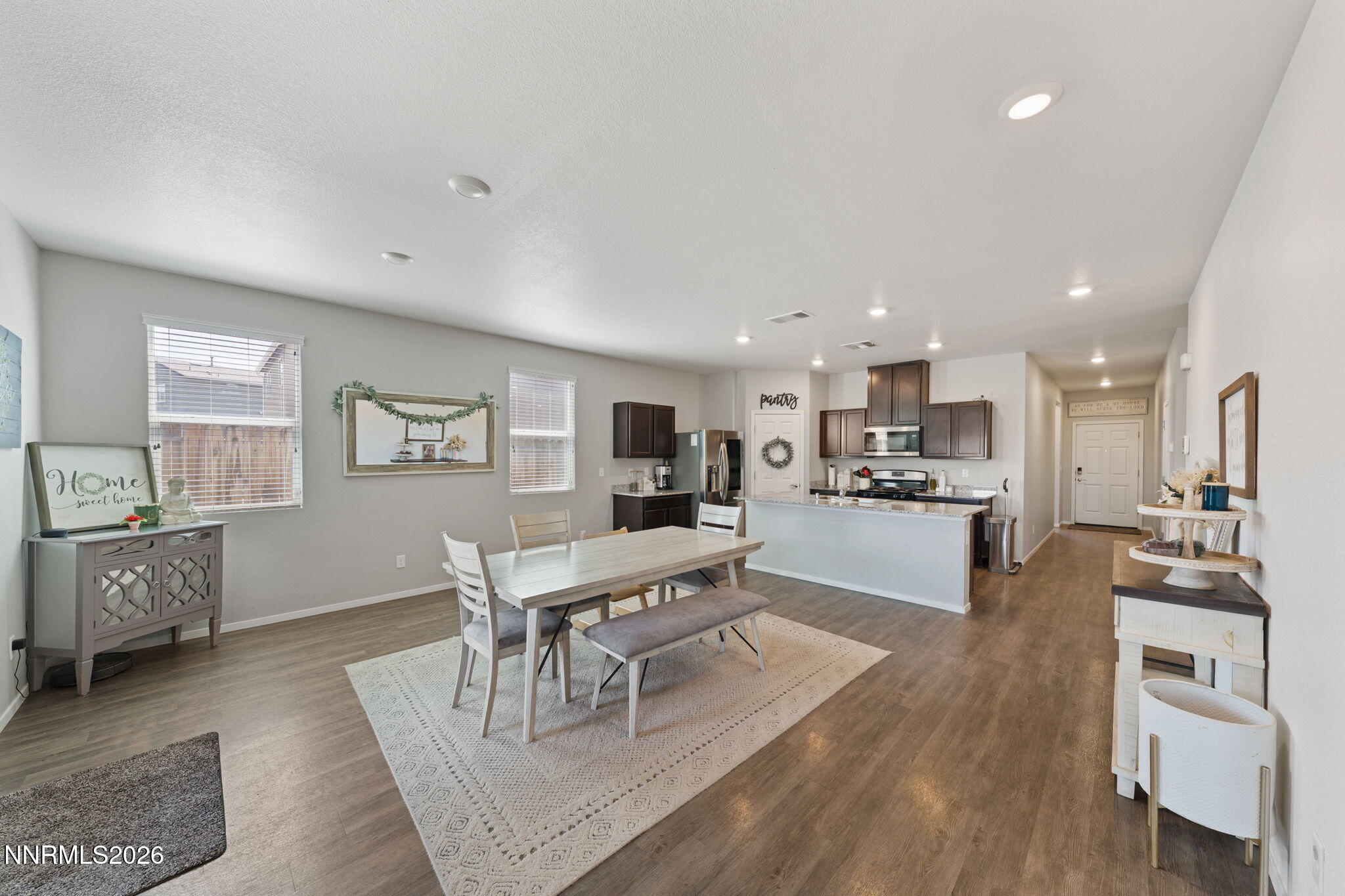 9708 Sea Glass Drive Reno, NV 89506 - Photo 27 of 51 a kitchen with a table and chairs in it