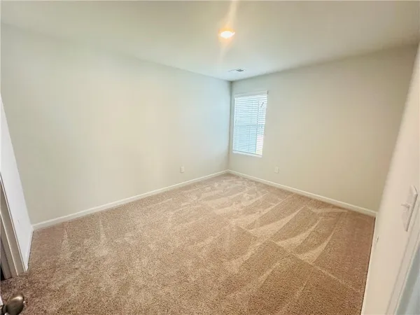 an empty room with a empty space and a window