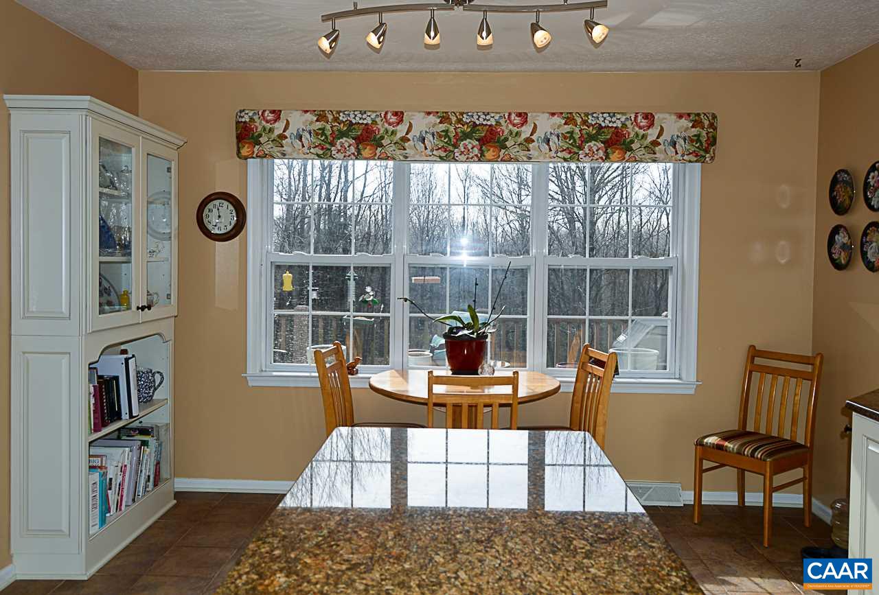 6688 Amicus Road Ruckersville, VA 22968 - Photo 13 of 43 a living room with furniture and a floor to ceiling window