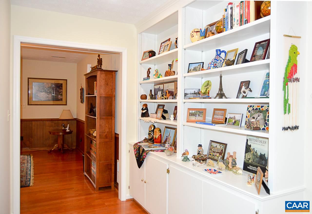 6688 Amicus Road Ruckersville, VA 22968 - Photo 25 of 43 a room with a baby crib and a book shelf