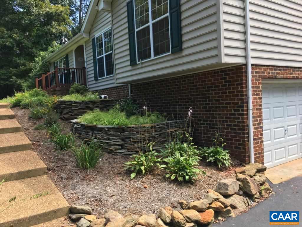 6688 Amicus Road Ruckersville, VA 22968 - Photo 4 of 43 a front view of a house with a yard