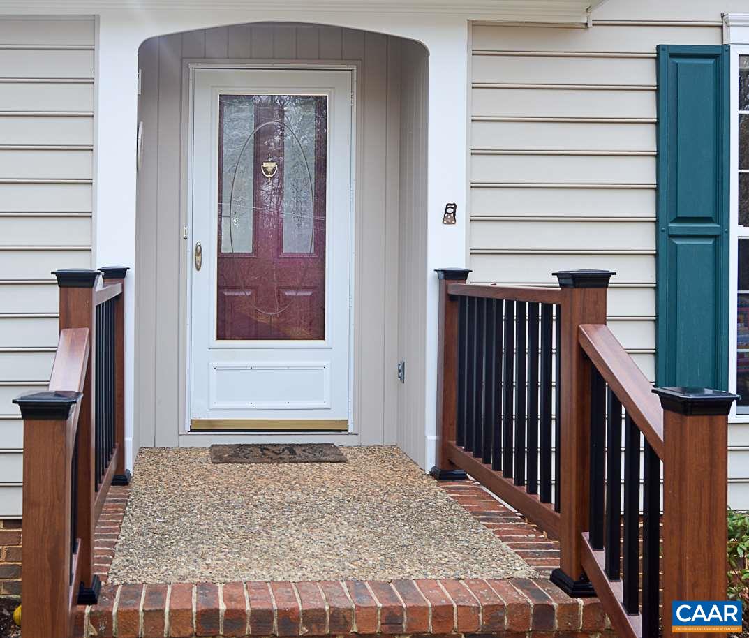 6688 Amicus Road Ruckersville, VA 22968 - Photo 5 of 43 a view of a hallway with wooden floor and staircase