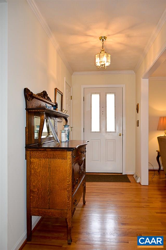 6688 Amicus Road Ruckersville, VA 22968 - Photo 6 of 43 a view of a livingroom with wooden floor and staircase