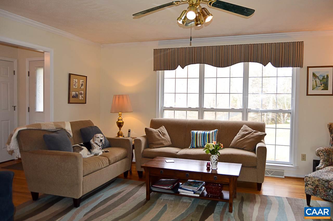 6688 Amicus Road Ruckersville, VA 22968 - Photo 8 of 43 a living room with furniture and a large window