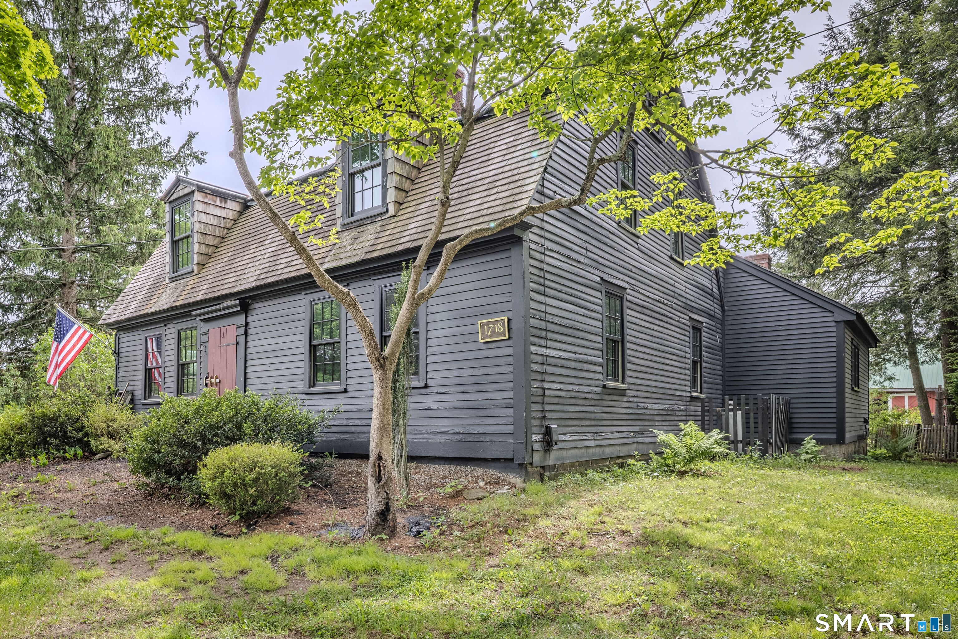 261 Hebron Road Bolton, CT 06043 - Photo 5 of 40 a front view of a house with garden
